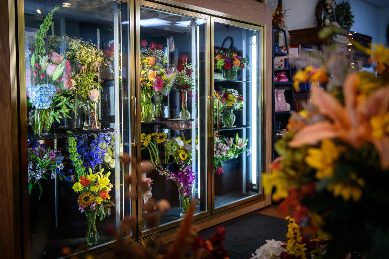 A variety of fresh flower arraignments sit in a cooler at Ann's Flower Shop at 5780 Ramsey St.