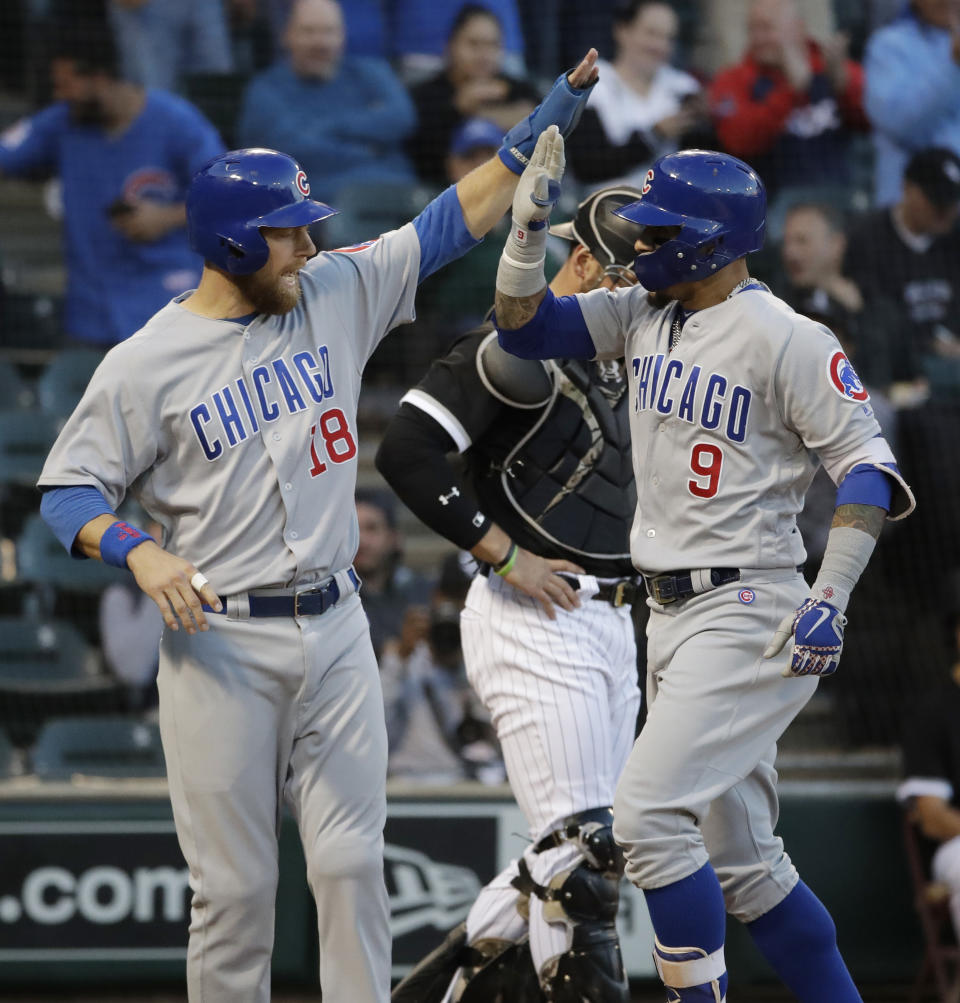 Chicago Cubs' Javier Baez, right, celebrates with Ben Zobrist after hitting a two-run home run against the Chicago White Sox during the first inning of a baseball game Saturday, Sept. 22, 2018, in Chicago. (AP Photo/Nam Y. Huh)