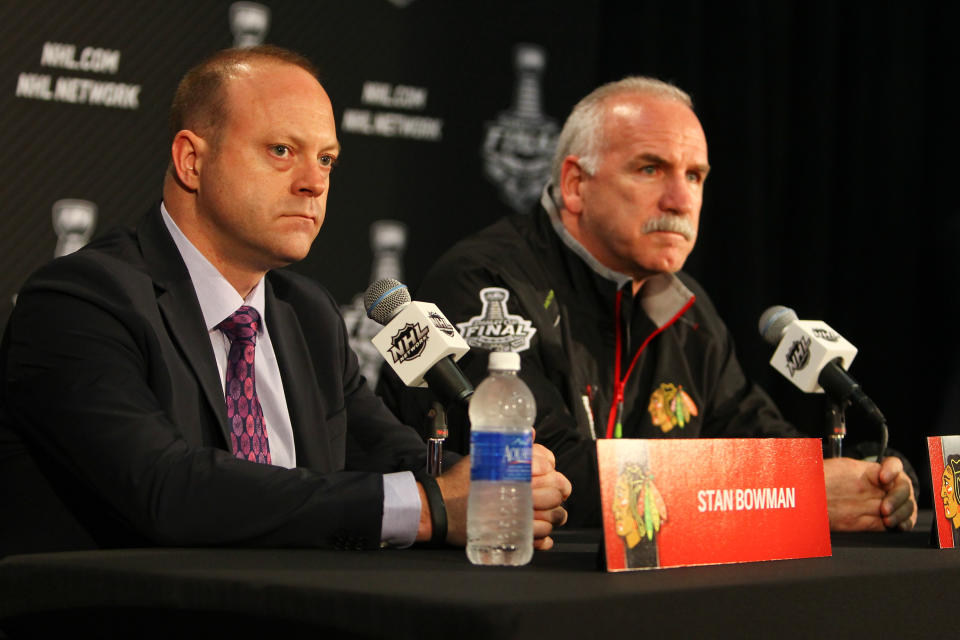 Stan Bowman, left, and Joel Quenneville are eligible to return to employment within the NHL. (Chase Agnello-Dean/NHLI via Getty Images)