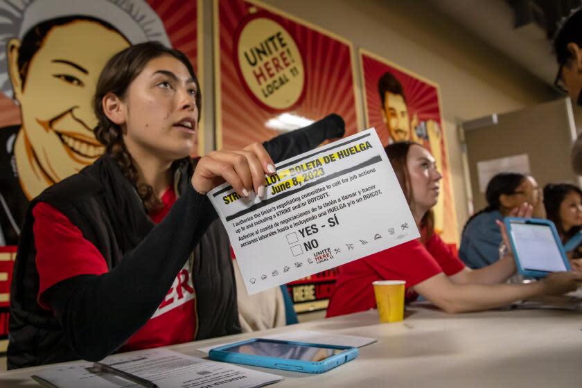 LOS ANGELES, CA - JUNE 08: Marissa Langley attends to hotel workers coming for strike authorization vote at Unite Here 11 office, Los Angeles, CA. (Irfan Khan / Los Angeles Times)