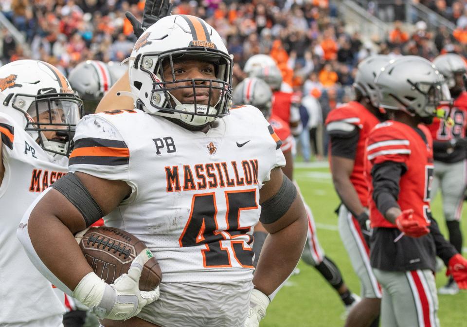 After scoring a touchdown, Massillon’s Michael Wright Jr. poses in front of the McKinley student section Saturday, Oct. 21, 2023.