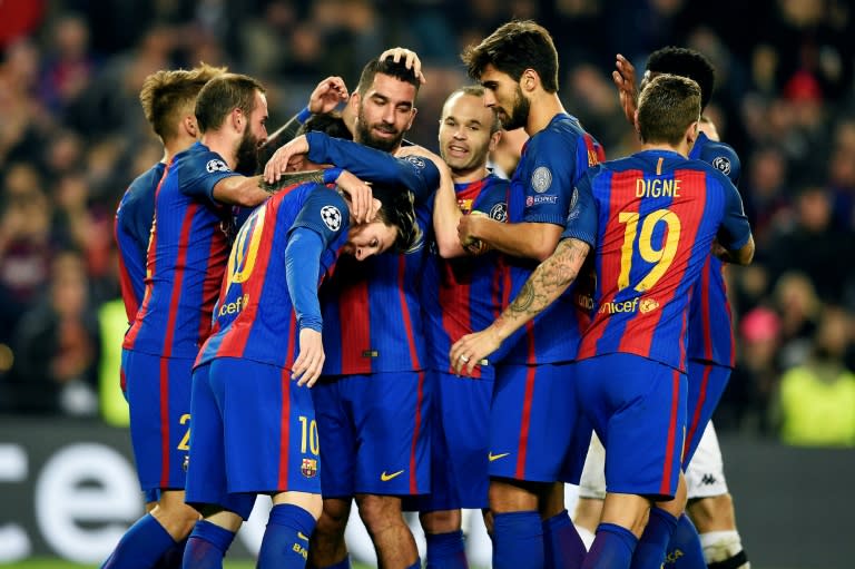 Barcelona's Arda Turan (C) celebrates with teammates after scoring a goal during their UEFA Champions League Group C match against Borussia Moenchengladbach, at the Camp Nou stadium in Barcelona, on December 6, 2016