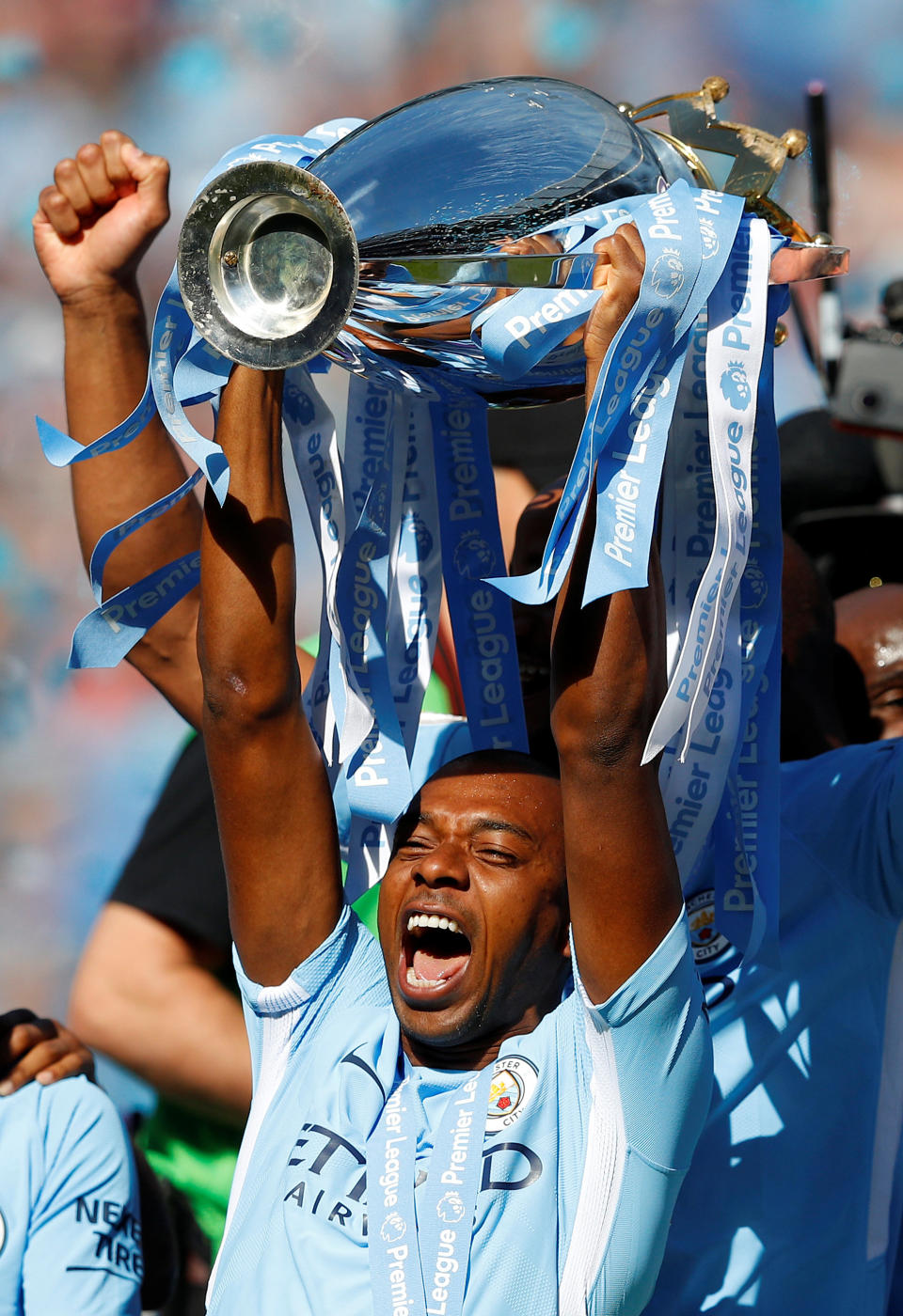 <p>Soccer Football – Premier League – Manchester City vs Huddersfield Town – Etihad Stadium, Manchester, Britain – May 6, 2018 Manchester City’s Fernandinho celebrates with the trophy after winning the Premier League title REUTERS/Phil Noble EDITORIAL USE ONLY. No use with unauthorized audio, video, data, fixture lists, club/league logos or “live” services. Online in-match use limited to 75 images, no video emulation. No use in betting, games or single club/league/player publications. Please contact your account representative for further details. </p>