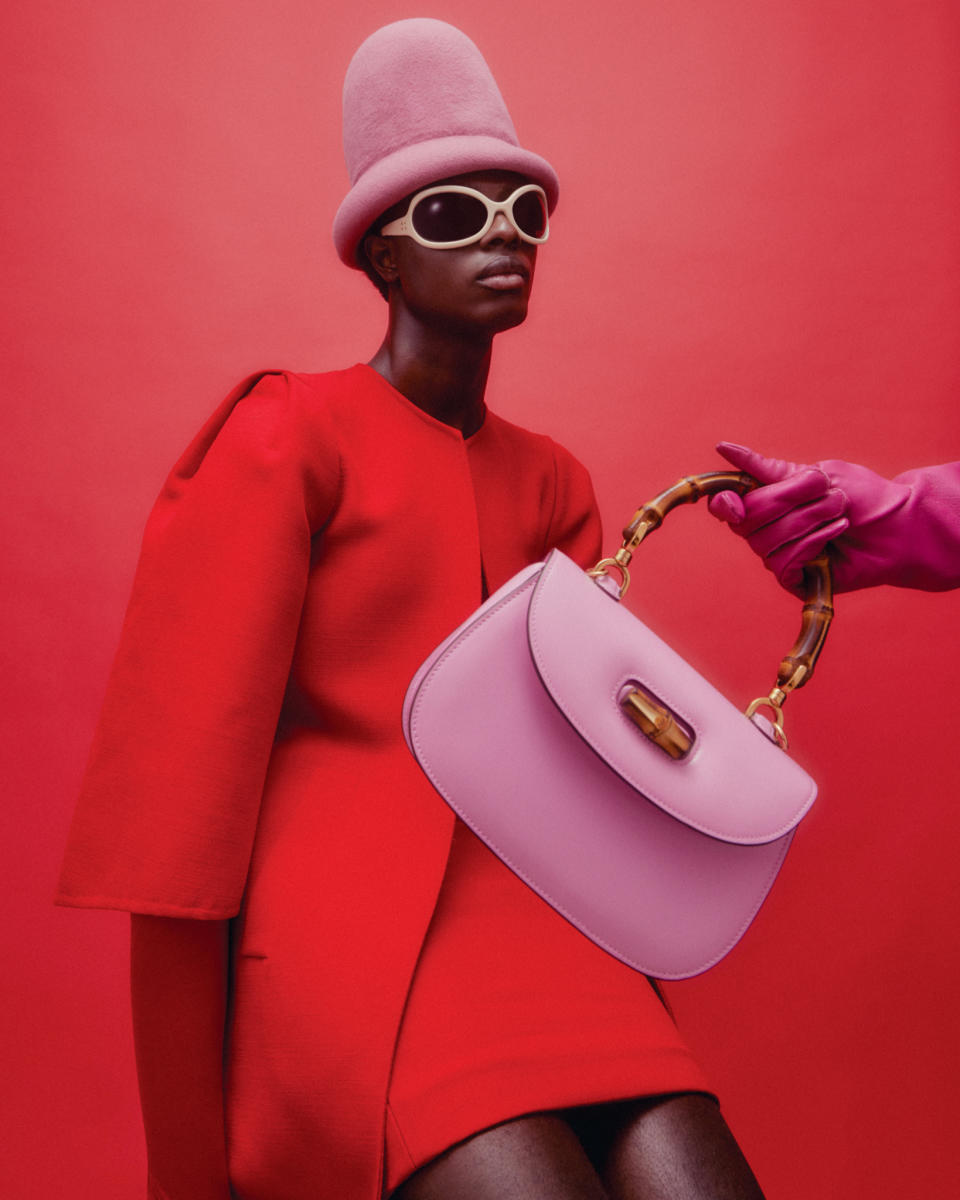 Gucci’s Bamboo 1947 mini top handle bag. Akris wool double-face coat and dress; Gucci sunglasses; Esenshel felt hat; Wing & Weft leather gloves.