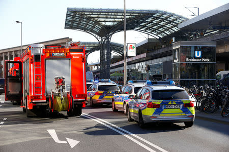 German police vehicles are parked near the main train station in Cologne, Germany, October 15, 2018, after the train station was closed after hostage-taking. REUTERS/Thilo Schmuelgen