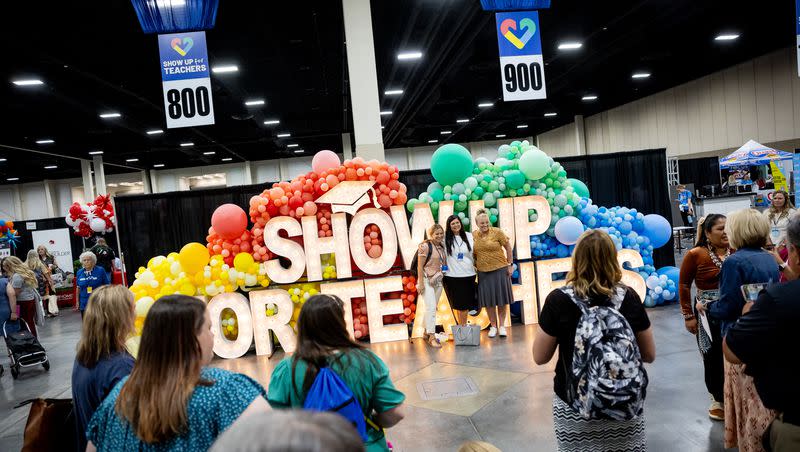 Attendees pose for photos at the Show Up for Teachers Conference at the Mountain America Expo Center in Sandy on Wednesday, July 19, 2023.