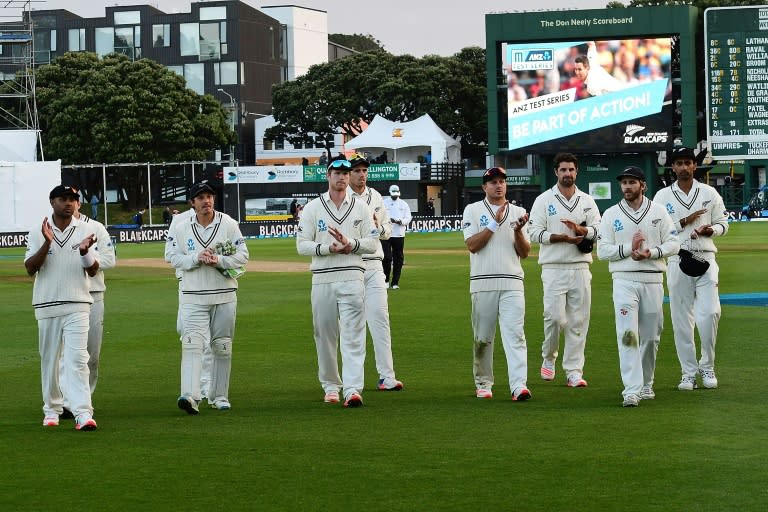 New Zealand's cricketers walk off the field after loosing their 2nd Test against South Africa, at the Basin Reserve in Wellington, on March 18, 2017