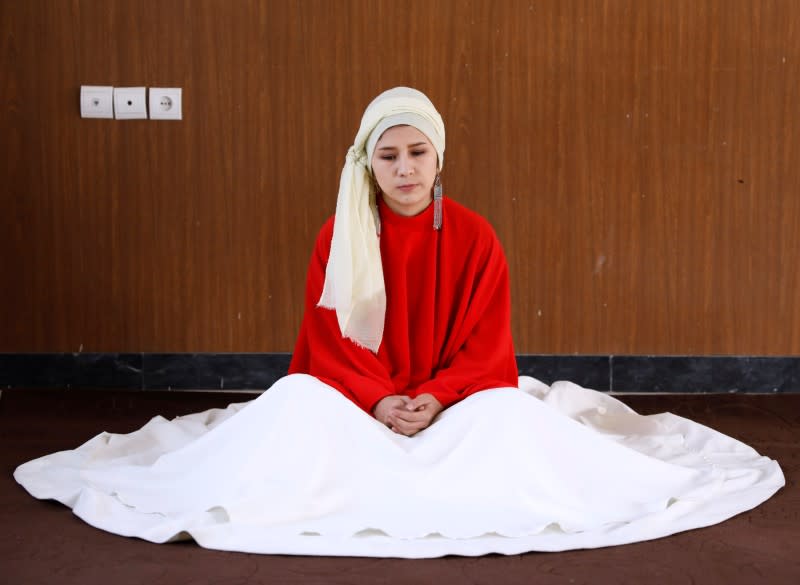 Mirzaie, founder of a Sama Dance group, meditates before dance in Kabul