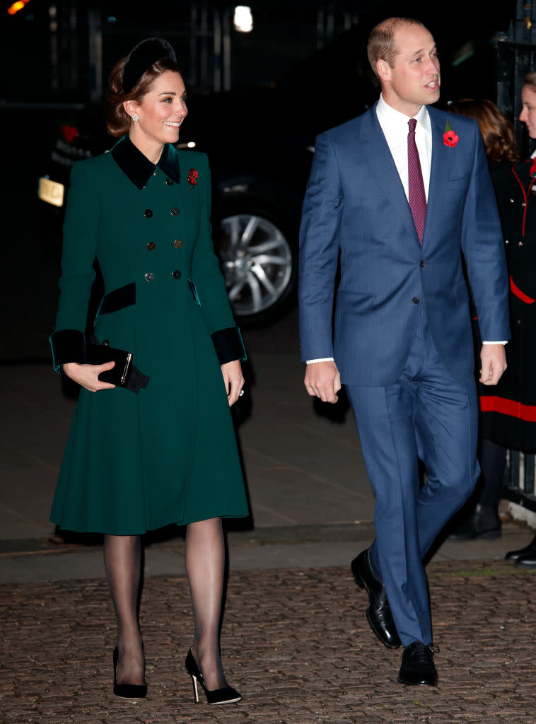<p>For an evening Remembrance Service at Westminster Abbey, the Duchess recycled a Catherine Walker coat. This time, she accessorised the look with a velvet headband. <em>[Photo: Getty]</em> </p>
