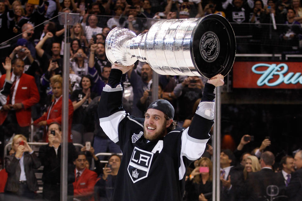 LOS ANGELES, CA - JUNE 11: Assistant captain Anze Kopitar #11 of the Los Angeles Kings holds up the Stanley Cup after the Kings defeated the New Jersey Devils 6-1 to win the Stanley Cup series 4-2 in Game Six of the 2012 Stanley Cup Final at Staples Center on June 11, 2012 in Los Angeles, California. (Photo by Bruce Bennett/Getty Images)