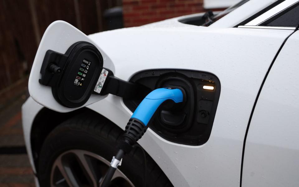 An electric charging cable connected to a Jaguar I-Pace electric car at a residential home. PA Photo. Picture date: Wednesday November 18, 2020. Photo credit should read: Andrew Matthews/PA Wire - Andrew Matthews/PA Wire
