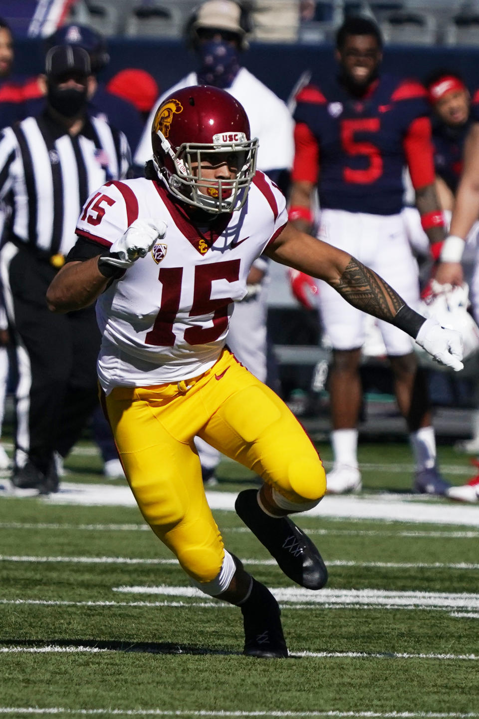 FILE - In this Nov. 14, 2020, file photo, Southern California safety Talanoa Hufanga (15) chases a play in the second half of an NCAA college football game against Arizona in Tucson, Ariz. Hufanga was selected as the PAC-12 defensive player of the year. (AP Photo/Rick Scuteri, File)