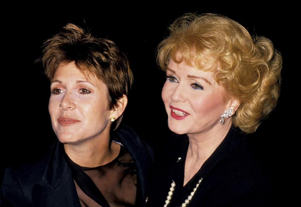 The mother-daughter duo at a New York City event for Reynolds's movie <em>The Unsinkable Molly Brown.</em>