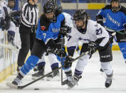 Toronto's Olivia Knowles (7) and Minnesota's Taylor Heise (27) battle for the puck during the first period of a PWHL hockey game in Toronto on Wednesday, May 1, 2024. (Frank Gunn/The Canadian Press via AP)