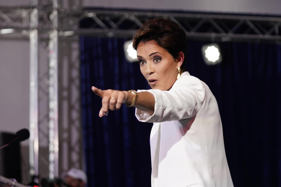 Republican candidate Kari Lake points to supporters as she announces her plans to run for the Arizona U.S. Senate seat during a rally, Tuesday, Oct. 10, 2023, in Scottsdale, Ariz. (AP Photo/Ross D. Franklin)