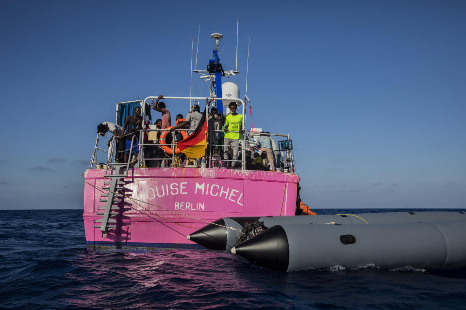 The Louise Michel rescue vessel with people rescued on board, after performing 2 rescue operations on the high seas in the past days, 70 miles south west Malta, Central Mediterranean sea, Saturday, Aug. 29, 2020. A rescue ship painted and sponsored by British artist Banksy saved another 130 migrants stranded on a rubber boat in the Southern Mediterranean Sea. (AP Photo/Santi Palacios)