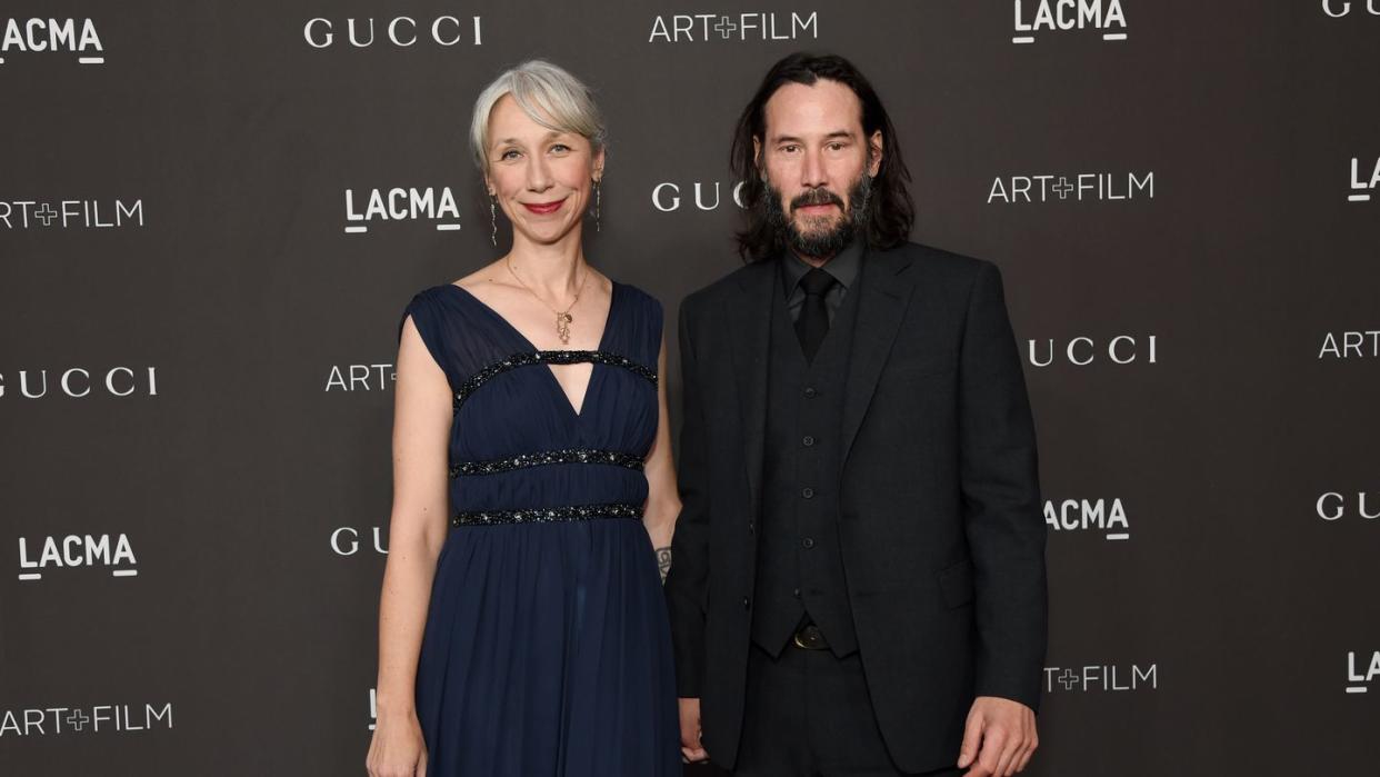 keanu reeves holds hands with alexandra grant on the red carpet at the 2019 lacma art film gala honoring betye saar and alfonso cuaron presented by gucci red carpet