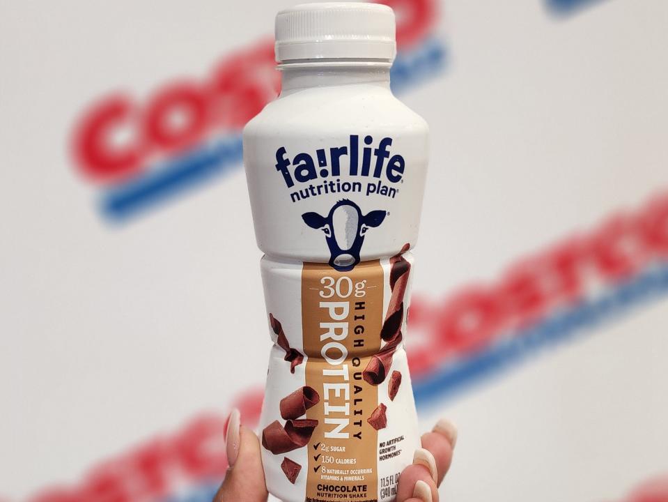 The writer holds a bottle of Fairlife protein drink