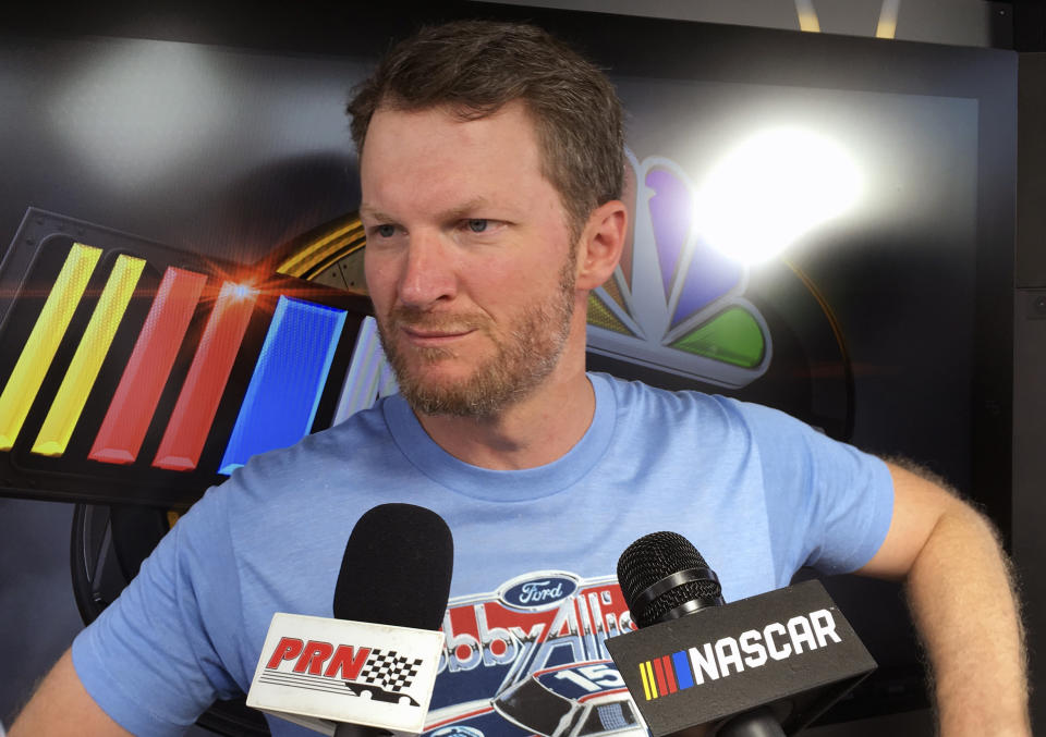 FILE - In this Friday, July 6, 2018 file photo, Dale Earnhardt Jr. goes through an interview during NASCAR auto racing pre-race activities at Daytona International Speedway in Daytona Beach, Fla. NASCAR television analyst and former driver Dale Earnhardt Jr. was taken to a hospital after his plane crashed in east Tennessee. (AP Photo/Mark Long, File)