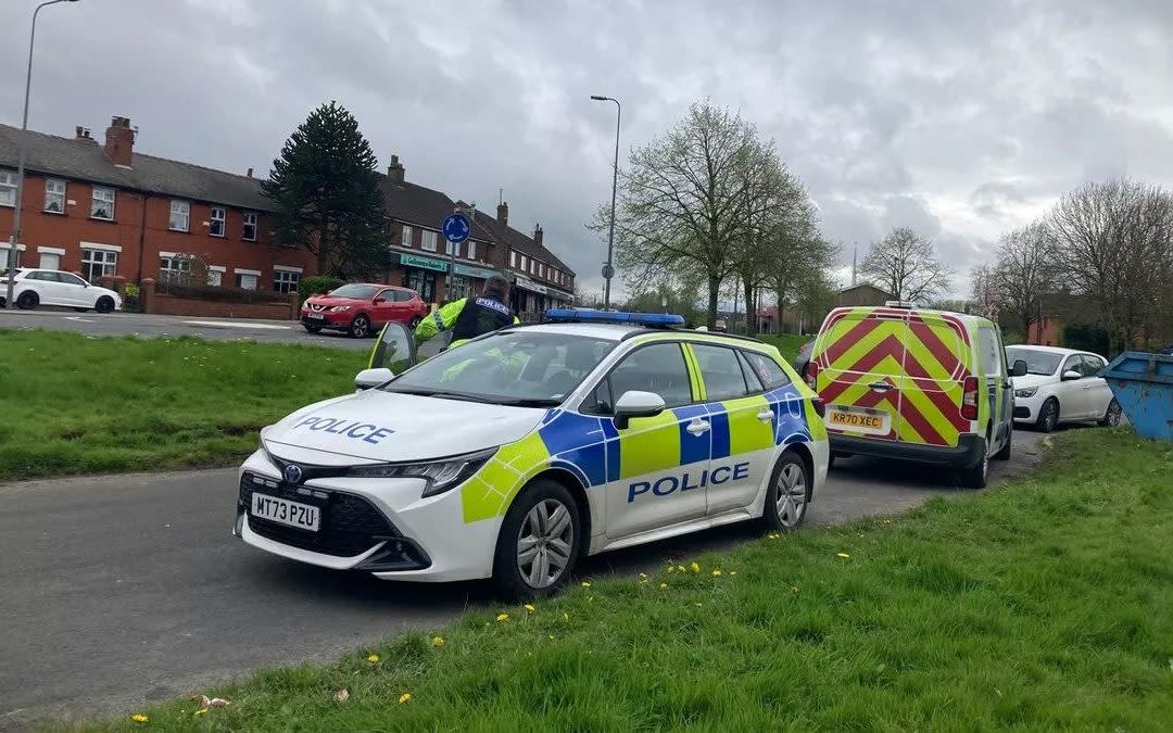 Police at the scene in Wigan