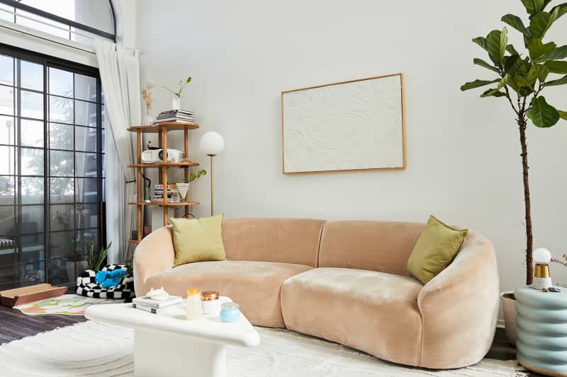 Curved sofa in living room.