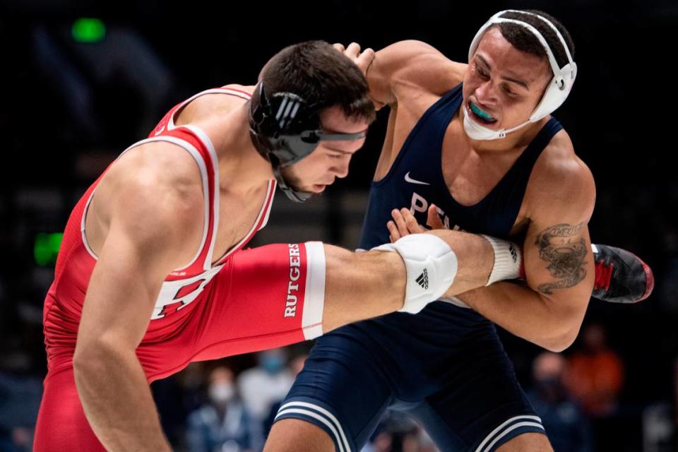 Penn State’s Aaron Brooks grabs his opponent’s leg during a wrestling dual between Penn State and Rutgers on Sunday, Jan. 16, 2022 at Rec Hall.