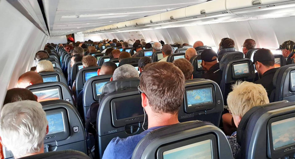 Anger over packed Qantas flight ignoring social distancing. Source: Twitter