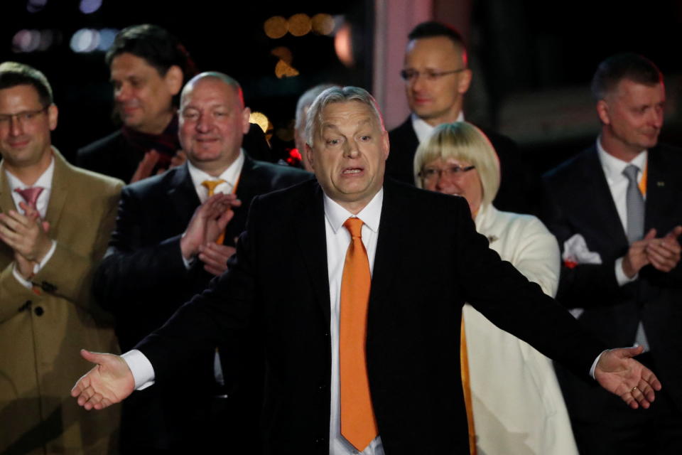 Hungarian Prime Minister Viktor Orban reacts in front of supporters after the announcement of the partial results of parliamentary election in Budapest, Hungary, April 3, 2022. REUTERS/Bernadett Szabo