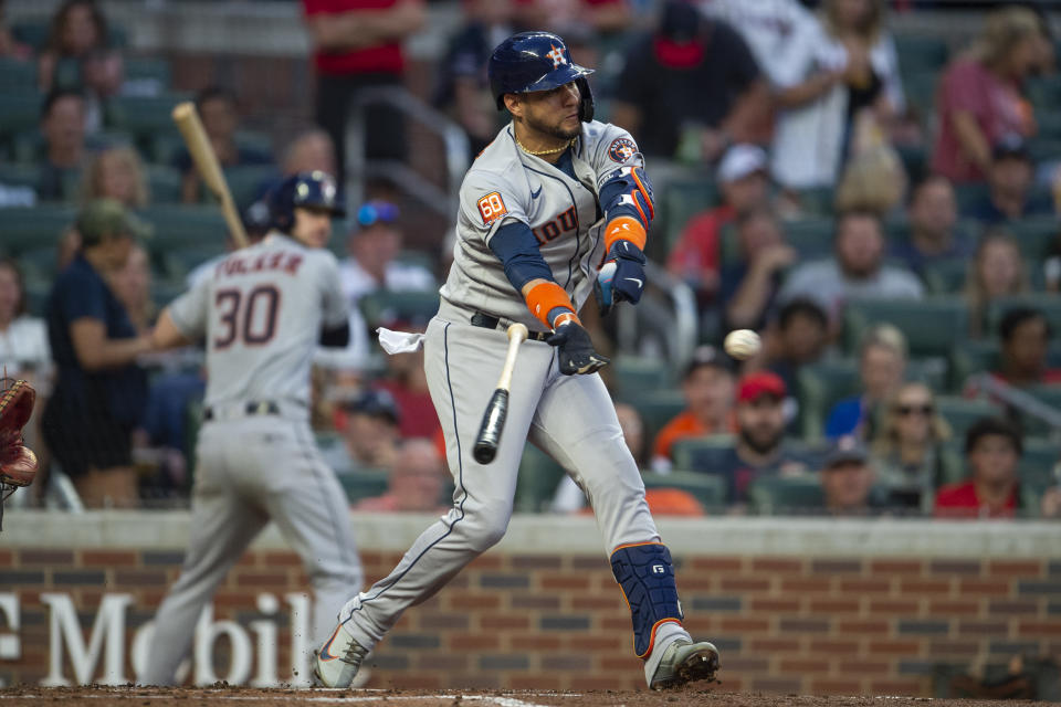 Houston Astros Yuli Gurriel swings and loses his bat in the third inning of a baseball game against the Atlanta Braves Saturday, Aug. 20, 2022, in Atlanta. (AP Photo/Hakim Wright Sr.)