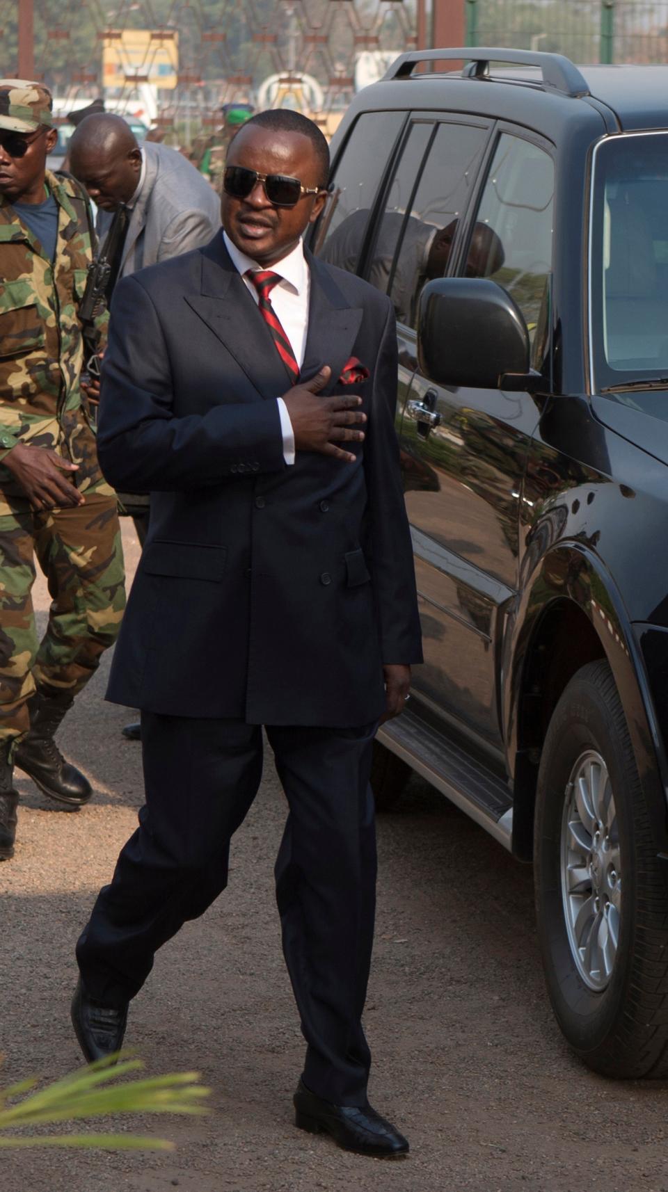 In this Wednesday, Jan. 8, 2013 photo, Alexandre Nguendet, president of the National Transition Council arrives at Mpoko Airport for a flight to neighboring Chad, in Bangui, Central African Republic. Michel Djotodia, the rebel leader who seized control of Central African Republic only to see the desperately poor country tumble toward anarchy and sectarian bloodshed, agreed to resign Friday along with his prime minister, regional officials announced. Djotodia's departure leaves the country in the hands of a weak transitional government. (AP Photo/Rebecca Blackwell)