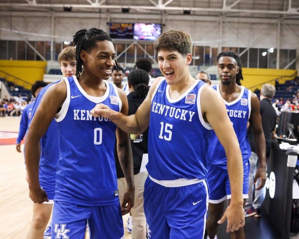 Reed Sheppard (15) and Rob Dillingham (0) celebrate following a UK win in the GLOBL JAM tournament this past summer in Canada. Sheppard and Dillingham are two of eight freshmen on the Kentucky team this season.