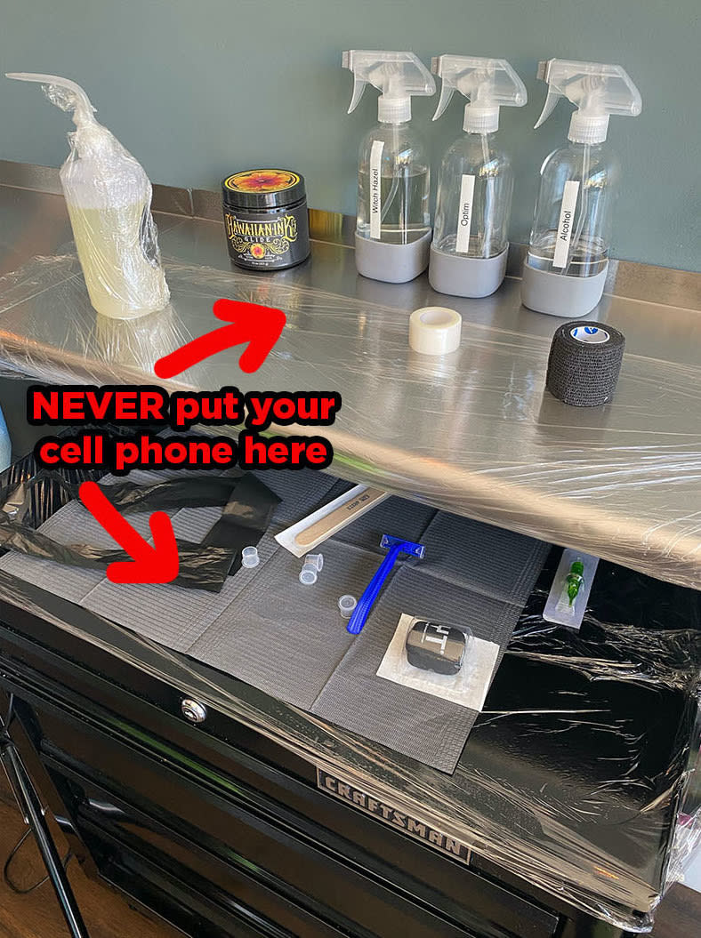 A photo showing where to never put your cellphone while tattooing.