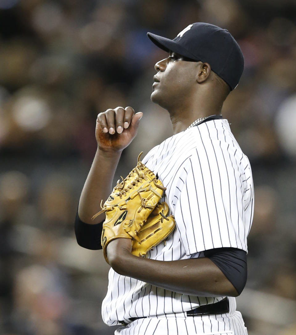 New York Yankees starting pitcher Michael Pineda looks on during the fourth inning of a baseball game against the Boston Red Sox at Yankee Stadium in New York, Thursday, April 10, 2014. (AP Photo/Kathy Willens)