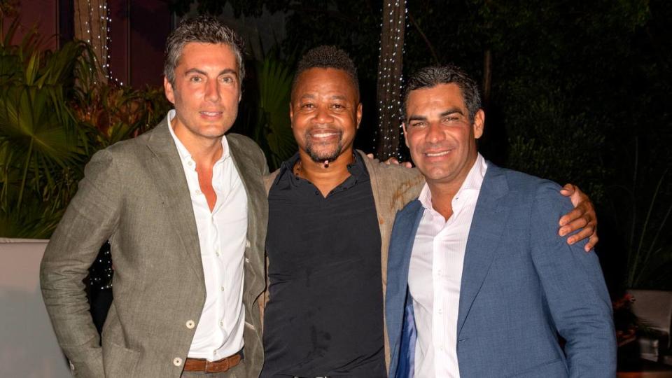 Fabian Basabe (left), actor Cuba Gooding, Jr. (center) and Miami Mayor Francis Suarez (right) are pictured during Amigos for Kids Miami Celebrity Domino Night on Sept. 24, 2022, in Miami.