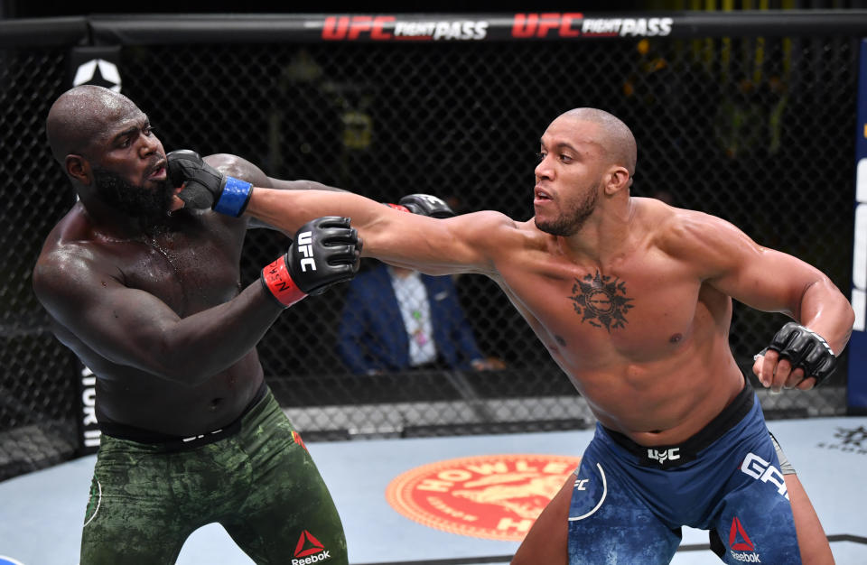 LAS VEGAS, NEVADA - FEBRUARY 27: (R-L) Ciryl Gane of France punches Jairzinho Rozenstruik of Suriname in a heavyweight bout during the UFC Fight Night event at UFC APEX on February 27, 2021 in Las Vegas, Nevada. (Photo by Jeff Bottari/Zuffa LLC)