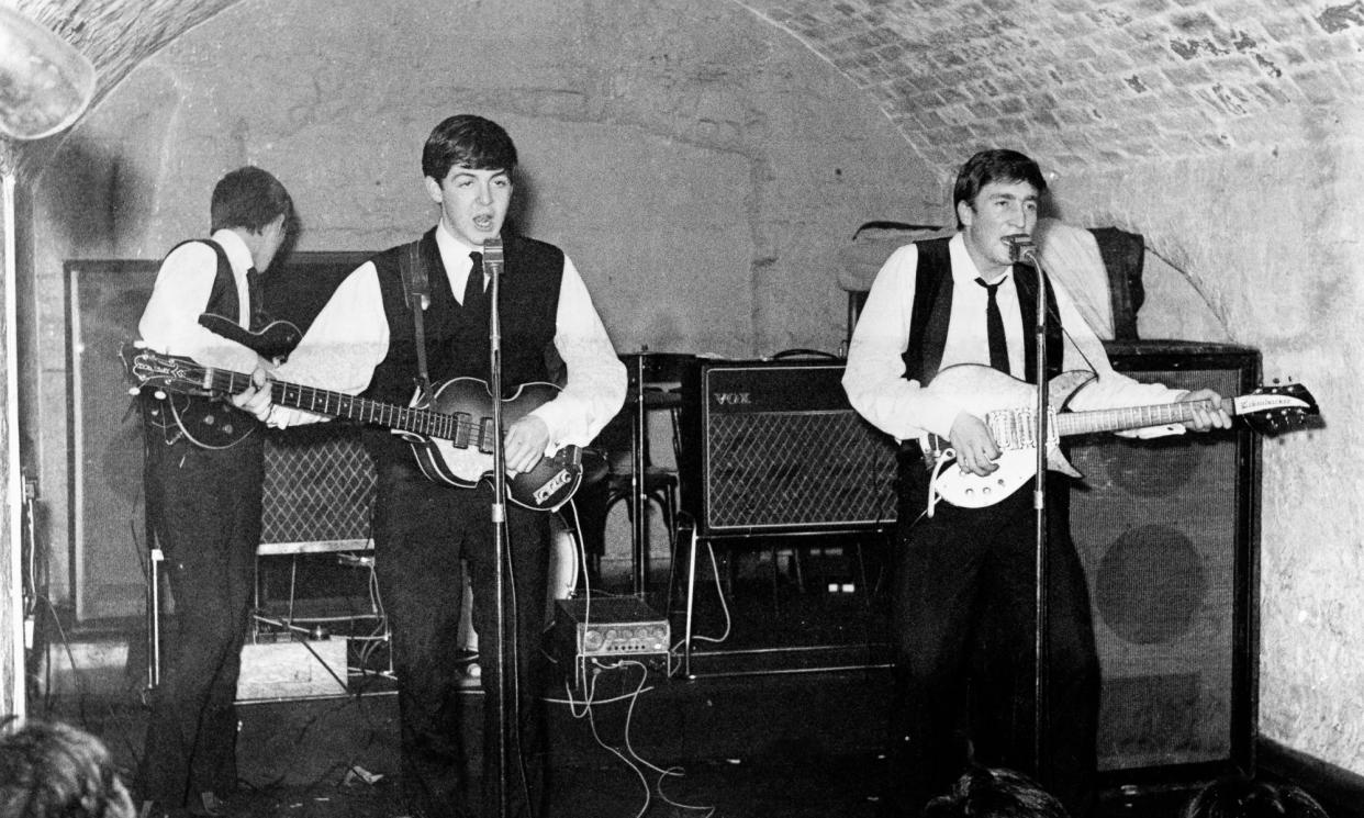 <span>The Beatles at the Cavern Club in Liverpool, 1962, with McCartney, centre, playing his Höfner bass.</span><span>Photograph: Michael Ochs Archives/Getty Images</span>