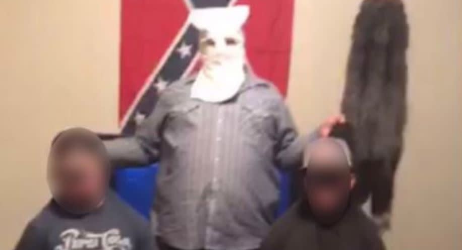 Two high school students in Utah have been disciplined after a photo depicting them in blackface being held by the neck by a non-student adult wearing a white hood was shared on social media. (Photo: Twitter)