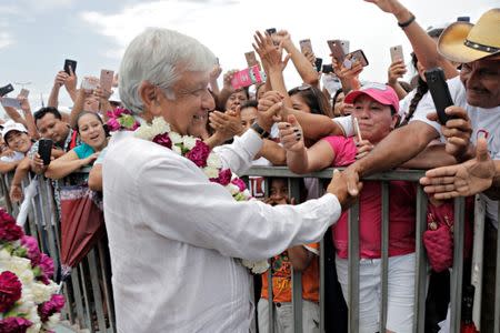 Mexican presidential candidate Andres Manuel Lopez Obrador greets supporters during a campaign rally, in Cancun, Mexico June 26, 2018. REUTERS/Israel Leal