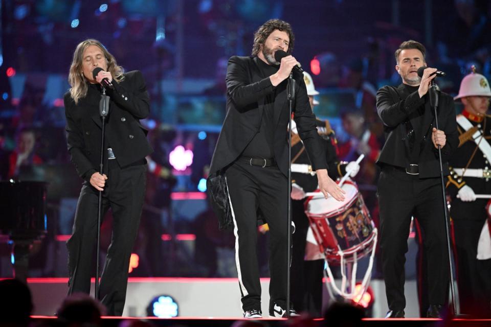 Mark Owen, Howard Donald and Gary Barlow from Take That on stage at the Coronation Concert (PA) (PA Wire)