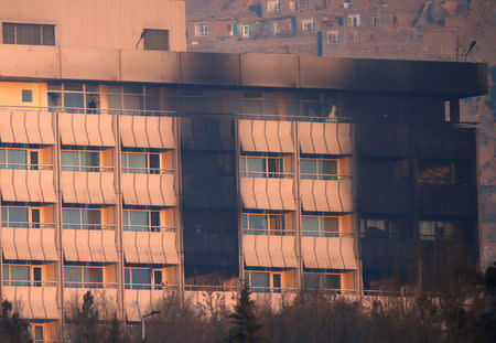 The Intercontinental Hotel is seen burnt during an attack in Kabul, Afghanistan January 21, 2018. REUTERS/Mohammad Ismail