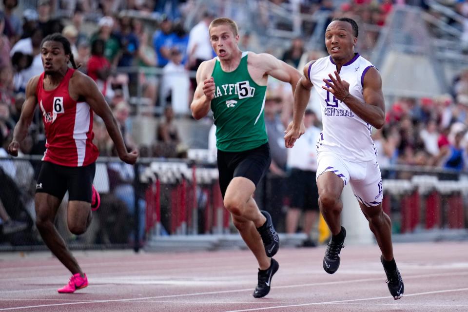 Right to left, Pickerington Central’s Troy Lane, Mayfield’s Nick Biega and Groveport Madison’s Sean Callahan compete in the 100 Saturday at state. Lane won in 10.44.