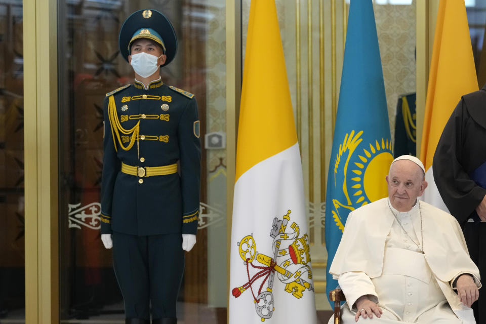 Pope Francis, left, meets the Kazakhstan's President Kassym-Jomart Tokayev as he arrives at Our-Sultan's International airport in Nur-Sultan, Kazakhstan, Tuesday, Sept. 13, 2022. Pope Francis begins a 3-days visit to the majority-Muslim former Soviet republic to minister to its tiny Catholic community and participate in a Kazakh-sponsored conference of world religious leaders. (AP Photo/Andrew Medichini)