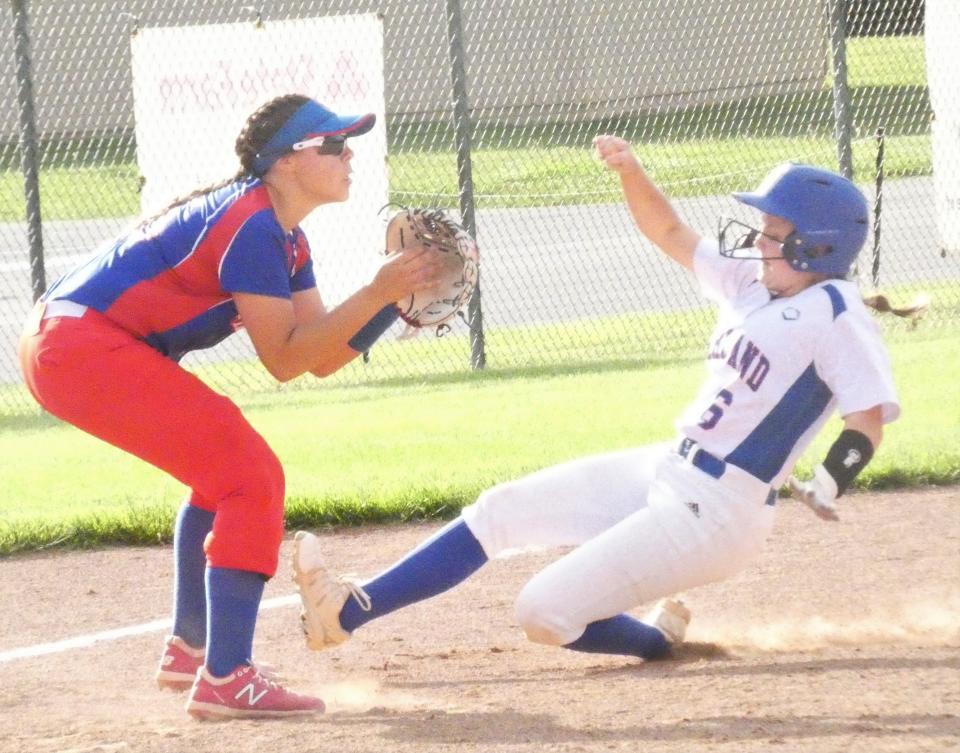 Highland senior Adyson Landefeld slides into third base for a triple as Lakewood junior Abby Colley waits for the throw during a Division II district semifinal at Olentangy on Monday, May 16, 2022. Landefeld scored on the play following an overthrow, but the Scots fell 8-2 to the Lancers.