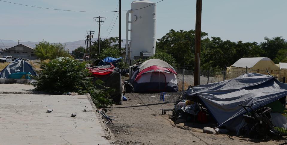 A homeless encampment is pictured on Aug. 7, 2023, just outside of Reno, Nevada. This Safe Camp model for a sanctioned homeless camp was considered a favorite of Salt Lake City leaders in April, shortly after they visited it. | Robin Pendergrast