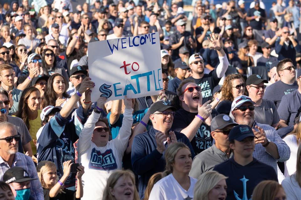 Fans celebrate at the Seattle Kraken expansion draft at Gas Works Park.