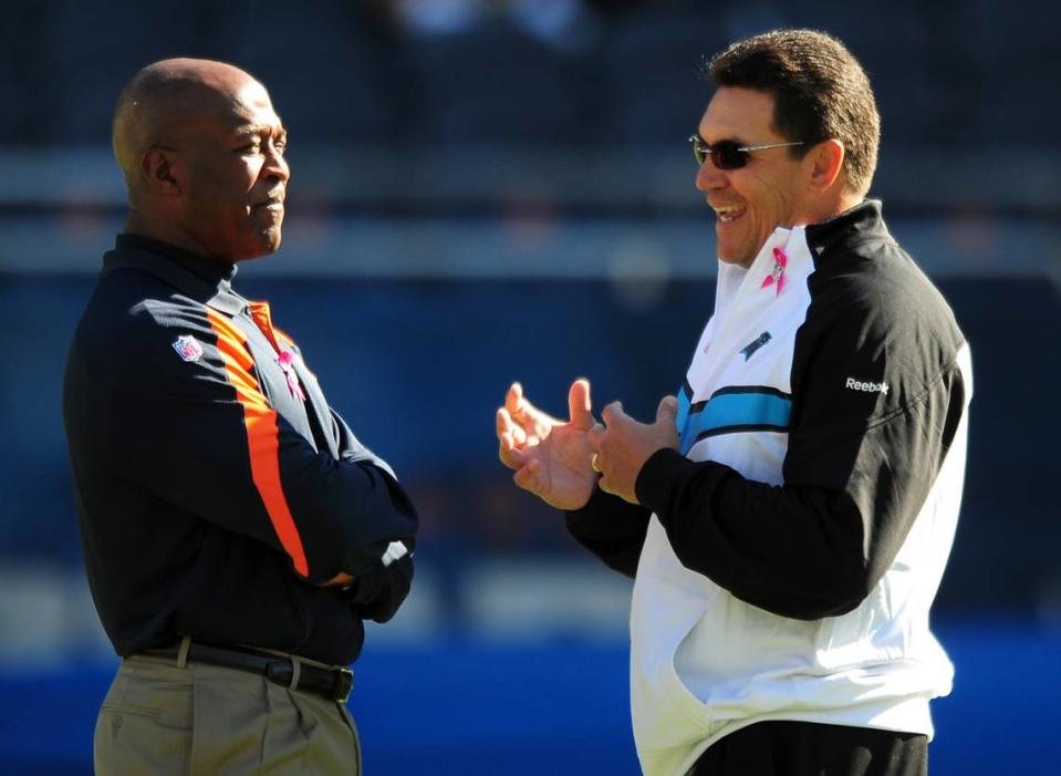 (L-R) Chicago Bears head coach Lovie Smith and Carolina Panthers head coach Ron Rivera talk Sunday, October 2, 2011 prior to the team’s game at Soldier Field in Chicago, IL. Jeff Siner - jsiner@charlotteobserver.com