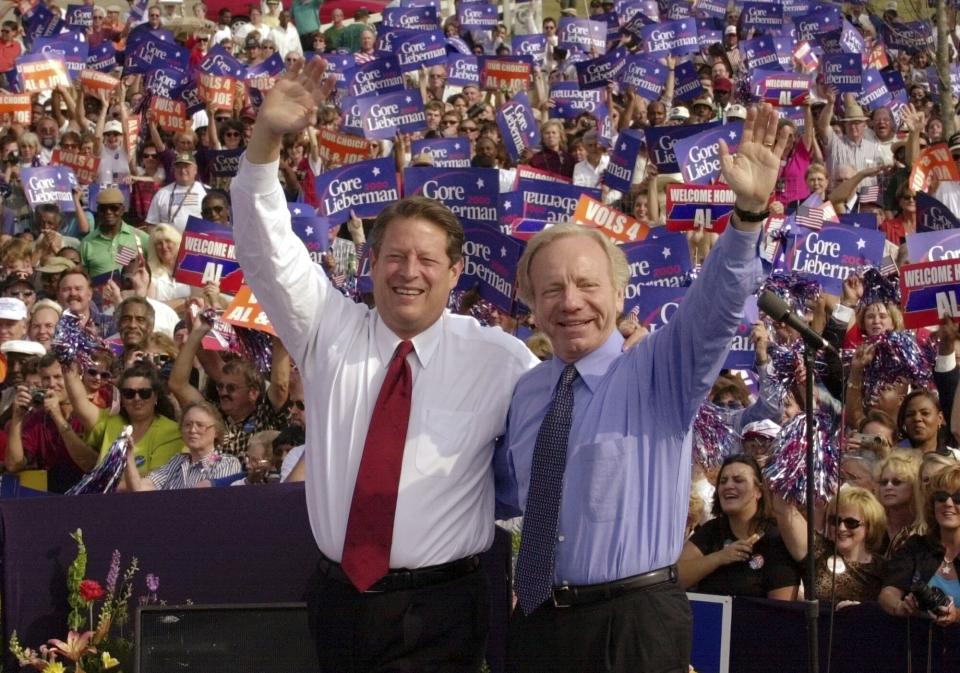 FILE - Democratic presidential candidate Vice President Al Gore, left, and his running mate, vice presidential candidate Sen. Joe Lieberman, of Connecticut, wave to supporters at a campaign rally in Jackson, Tenn., Oct. 25, 2000. A funeral for Lieberman will be held Friday, March 29, 2024, in his hometown of Stamford, Conn. Lieberman died in New York City on Wednesday, March 27, at age 82. (AP Photo/Stephan Savoia, File)