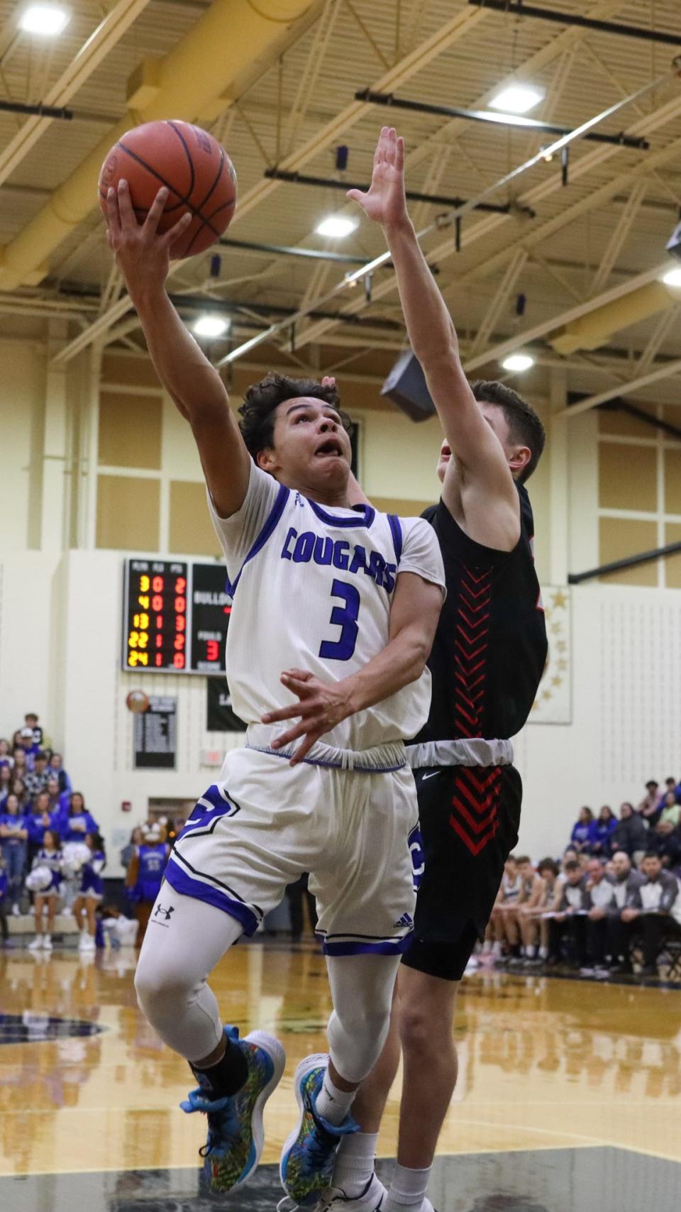 Chris Huerta goes up for two points in the Class 2A regional championship game against Wapahani at Lapel on March 11, 2023.