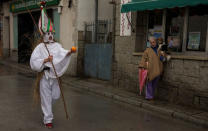 A reveller, dressed as "Zarramache", walks through the streets during celebrations to mark Saint Blaise's festivity in Casavieja, Spain February 3, 2017. REUTERS/Sergio Perez