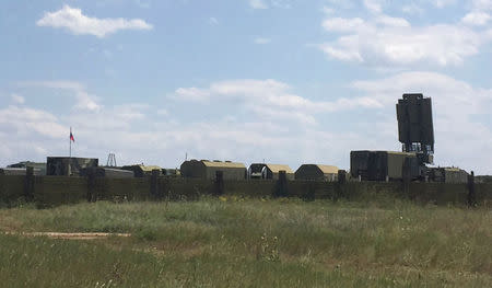 A view shows Russian military vehicles near an airfield in Dzhankoy, Crimea, July 7, 2016. REUTERS/Stringer